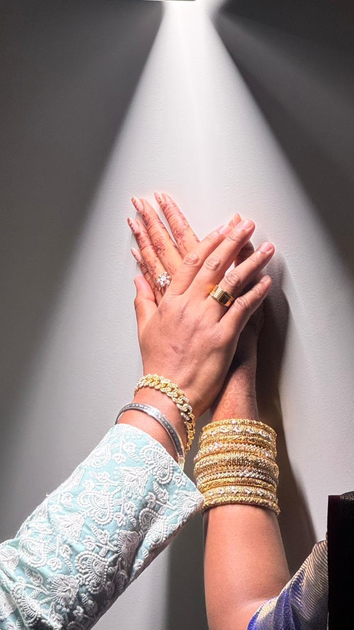 Rhea & Joshua showing their engagement rings
